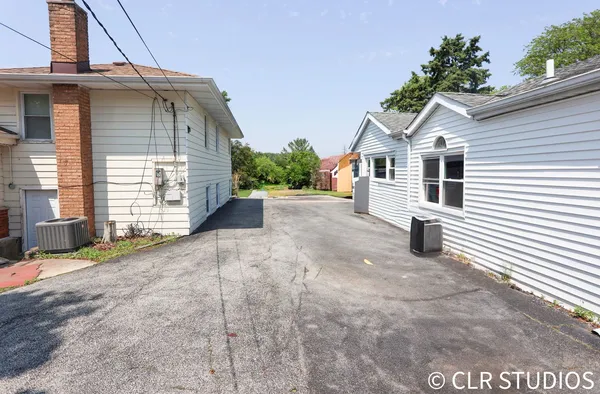 a view of a house with a street
