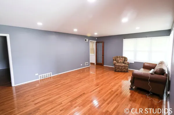 a view of livingroom with furniture and empty room