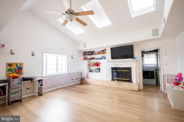 a living room with fireplace furniture and a flat screen tv