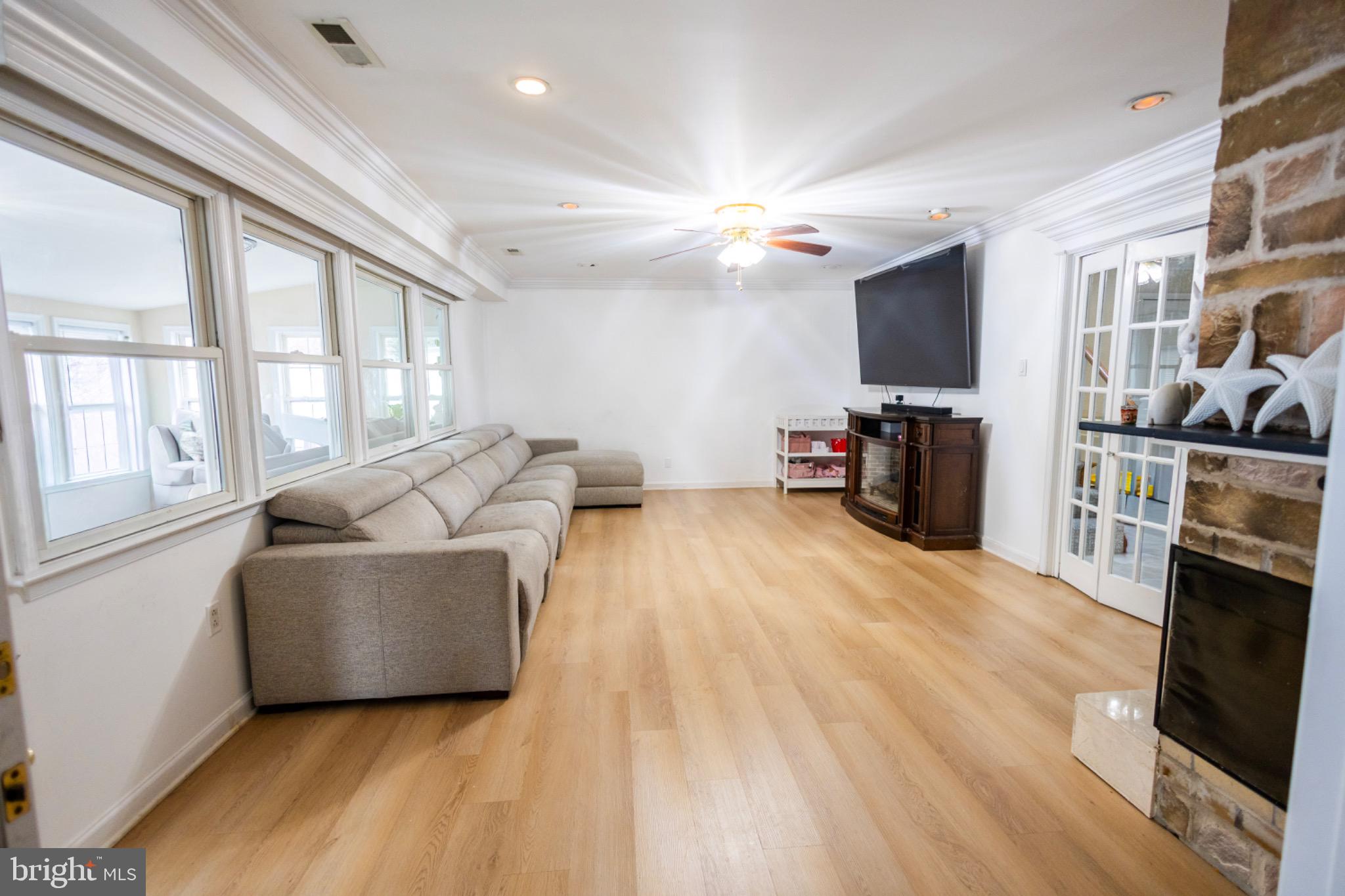 24 Rose Apple Road Levittown, PA 19056 - Photo 7 of 24 a living room with furniture and a flat screen tv