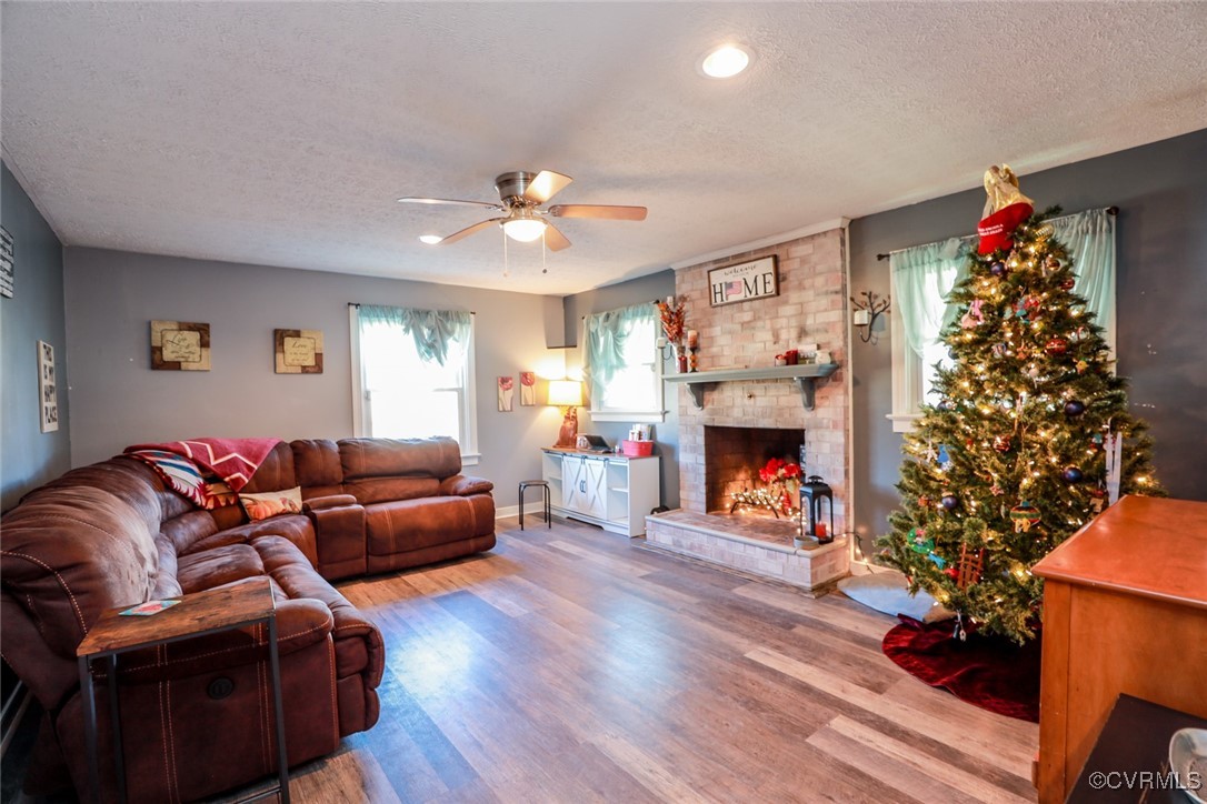 2976 Venter Road Aylett, VA 23009 - Photo 9 of 29 Living room featuring ceiling fan, a fireplace, wo