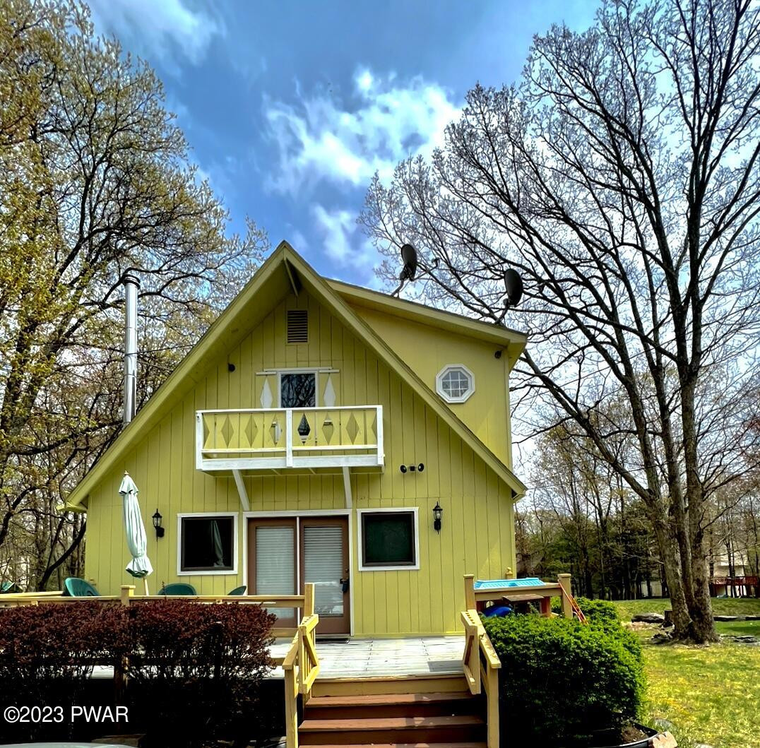 112 Stamford Road Dingmans Ferry, PA 18328 - Photo 2 of 26 a front view of a house with a garden