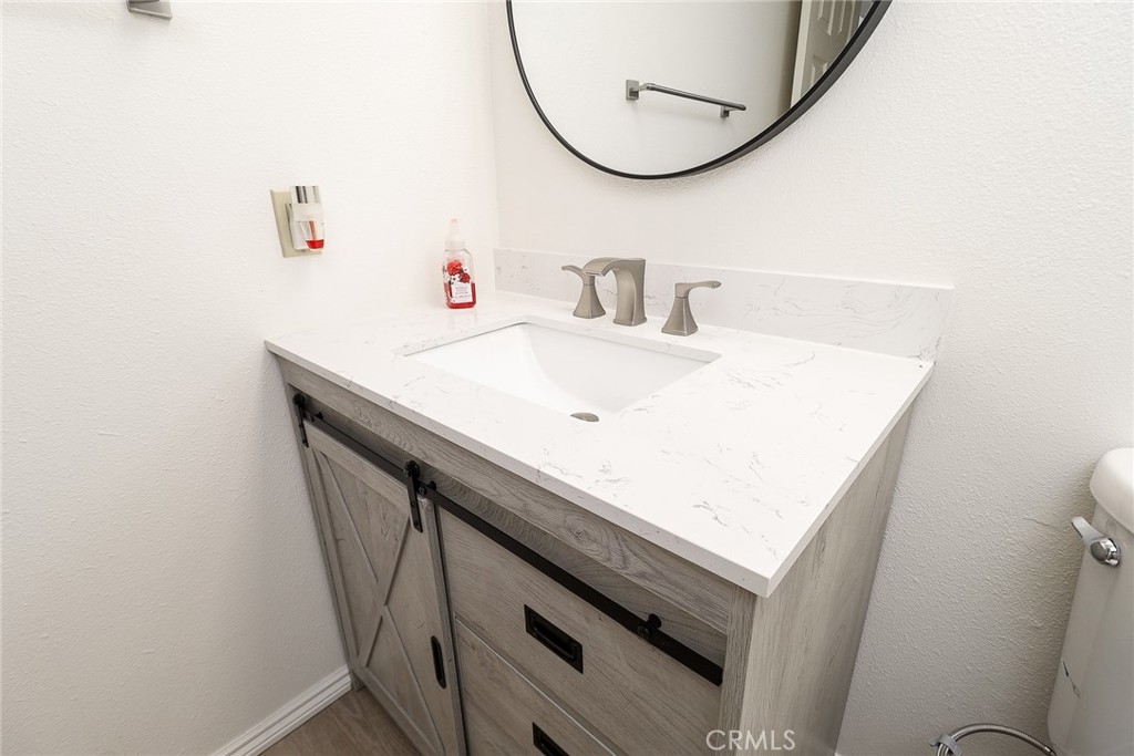 345 Jeremiah Drive, Unit C Simi Valley, CA 93065 - Photo 13 of 66 a bathroom with a sink and a mirror