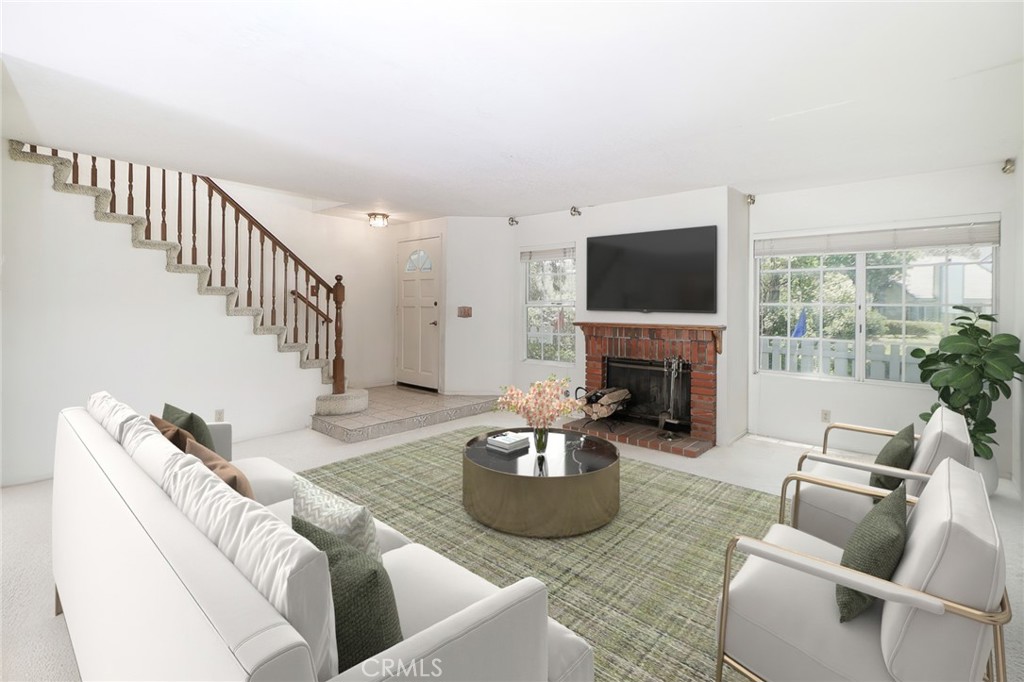 345 Jeremiah Drive, Unit C Simi Valley, CA 93065 - Photo 2 of 66 a living room with furniture a fireplace and a flat screen tv