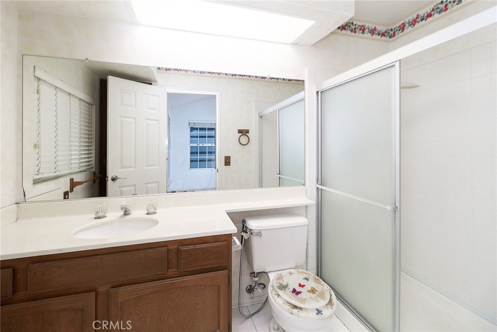 345 Jeremiah Drive, Unit C Simi Valley, CA 93065 - Photo 30 of 66 a bathroom with a sink a toilet and a mirror