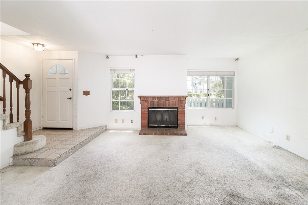 345 Jeremiah Drive, Unit C Simi Valley, CA 93065 - Photo 39 of 66 an empty room with windows fireplace and a bathroom