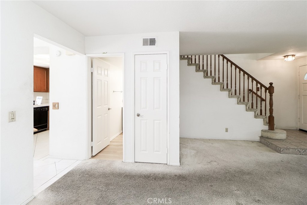 345 Jeremiah Drive, Unit C Simi Valley, CA 93065 - Photo 41 of 66 Stairway, coat closet, half bath entry and peep of the kitchen to the left!