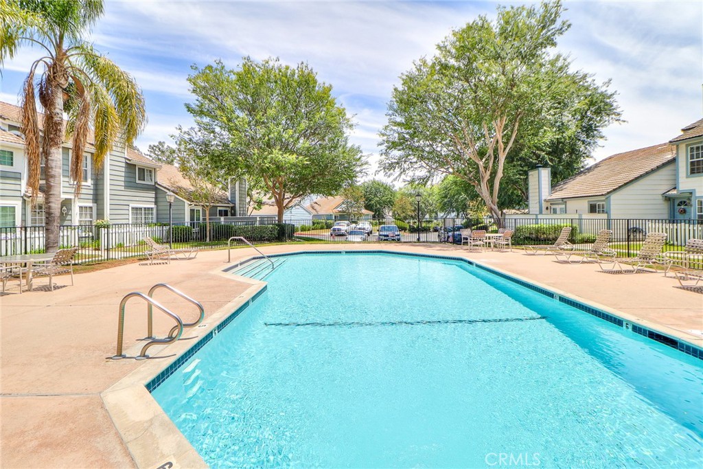 345 Jeremiah Drive, Unit C Simi Valley, CA 93065 - Photo 45 of 66 a view of swimming pool with outdoor seating and a pathway