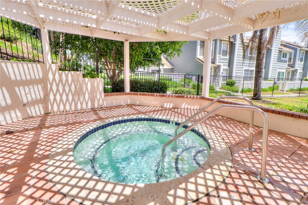 345 Jeremiah Drive, Unit C Simi Valley, CA 93065 - Photo 48 of 66 a swimming pool with outdoor seating and plants