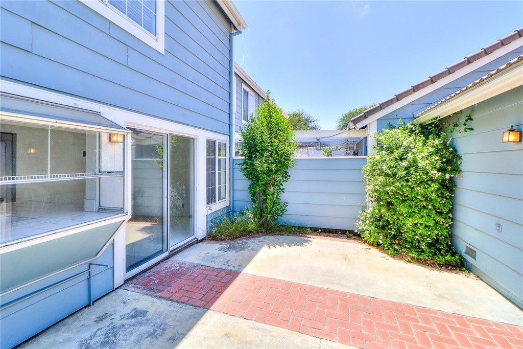 345 Jeremiah Drive, Unit C Simi Valley, CA 93065 - Photo 7 of 66 a view of backyard with potted plants and floor to ceiling window