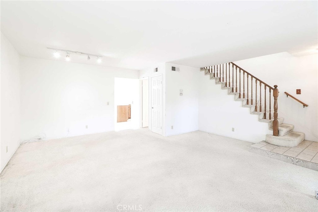 345 Jeremiah Drive, Unit C Simi Valley, CA 93065 - Photo 10 of 66 Living room to stairs