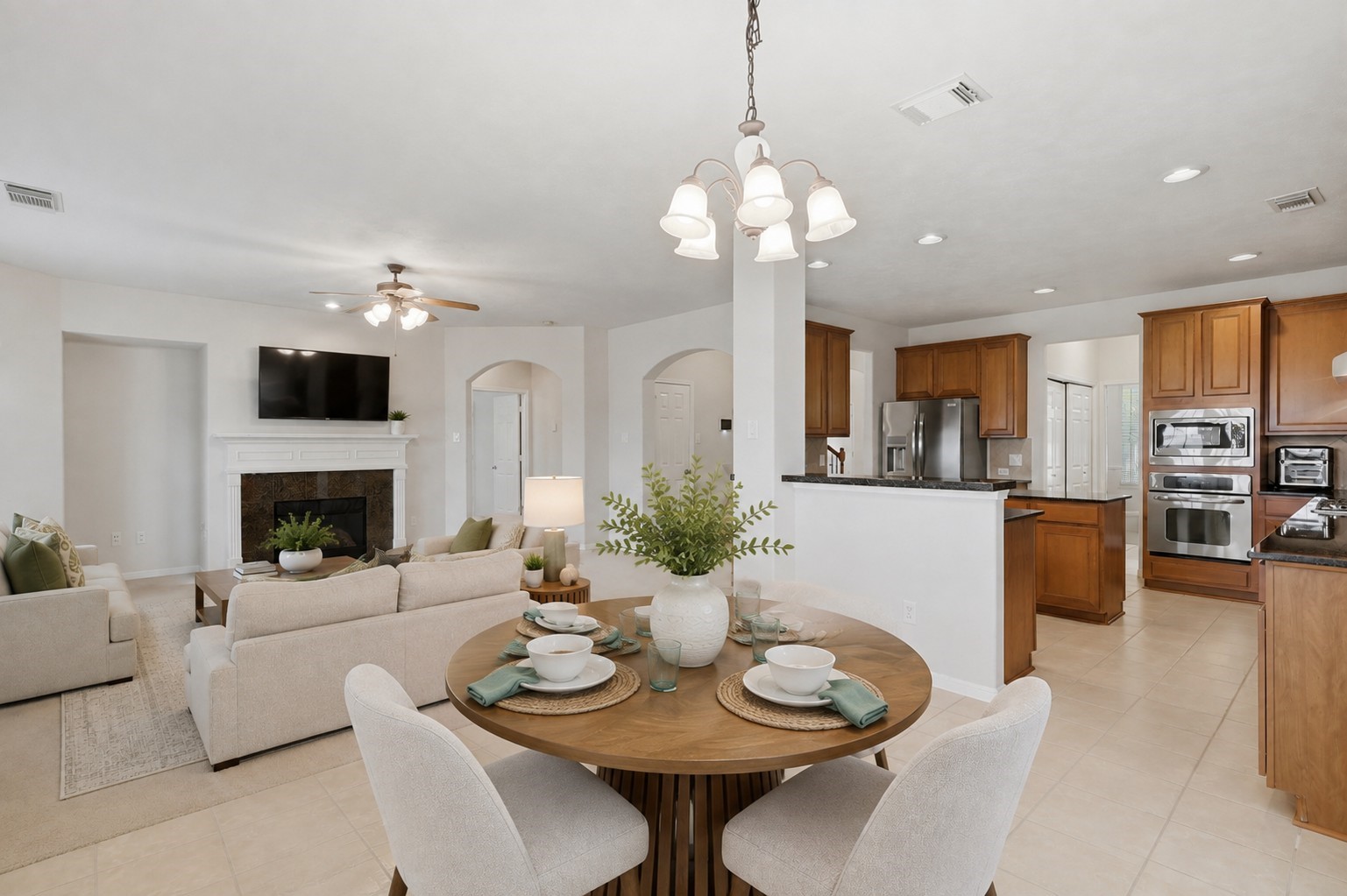 13806 Cove Landing Lane Rosharon, TX 77583 - Photo 16 of 44 An open-concept layout seamlessly connects the breakfast area, kitchen, and family room for easy everyday living and entertaining.**Virtually staged
