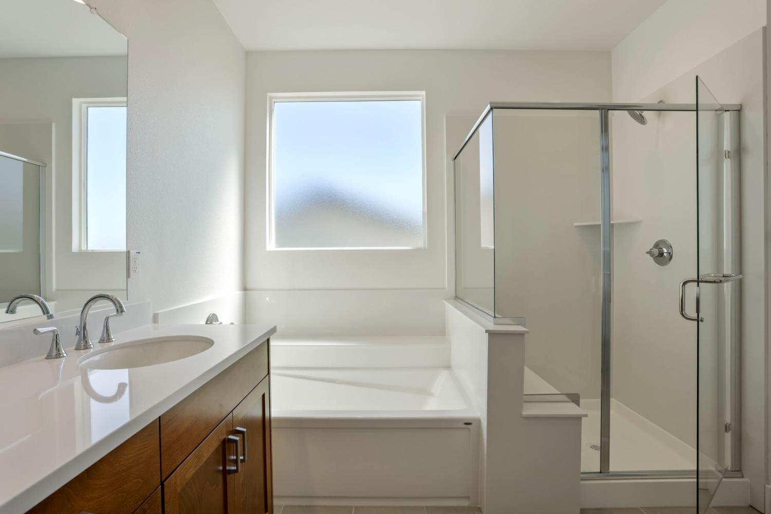 3265 Rugnao Way Manteca, CA 95337 - Photo 26 of 38 Deep soaking tub and shower with seat