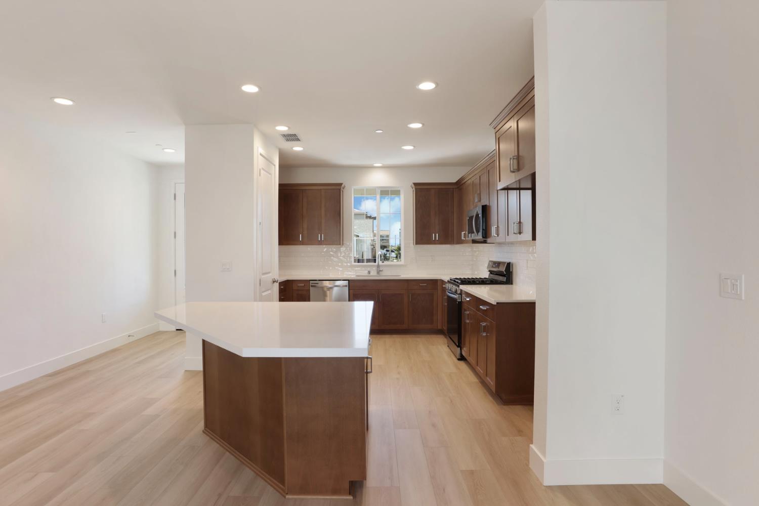 3265 Rugnao Way Manteca, CA 95337 - Photo 8 of 38 Overhang at island for casual dining