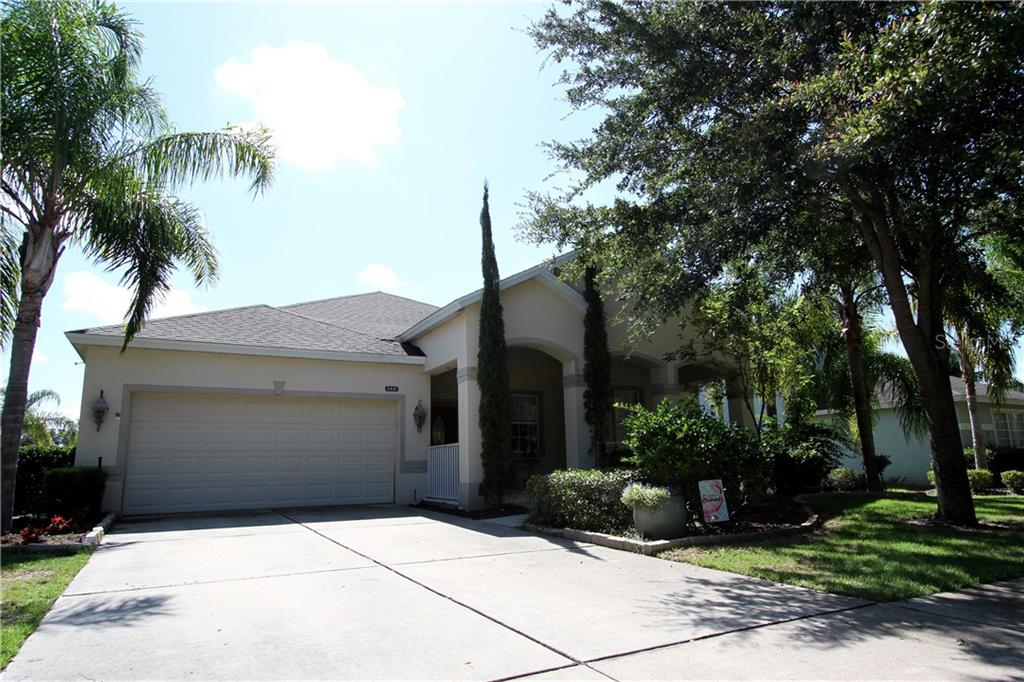 5447 Rishley Run Way Mount Dora, FL 32757 - Photo 1 of 1 a front view of a house with garden
