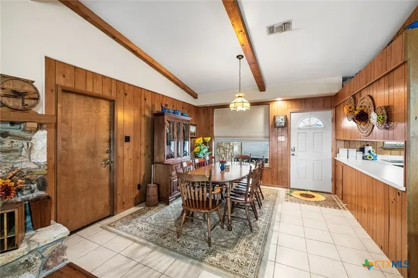 a view of a dining room with furniture