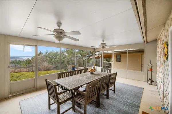 a view of a dining room with furniture window and outside view
