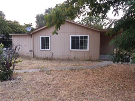 5510 Cedars Road Redding, CA 96001 - Photo 14 of 19 a house with trees in the background