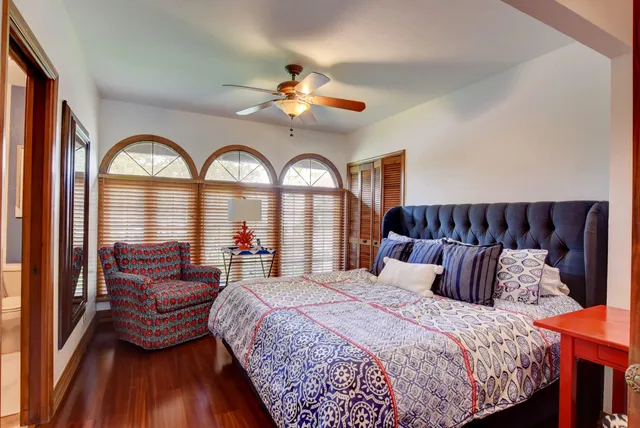 a bedroom with a large bed and a large bed