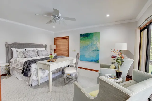 a bedroom with a bed and a table