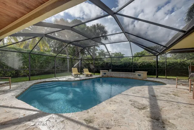 a view of a swimming pool with a patio