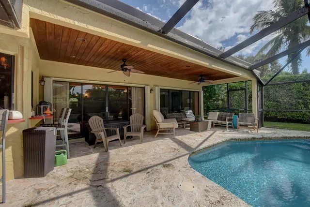 a view of a backyard with sitting area
