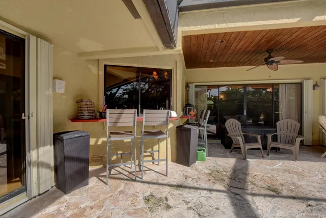 a view of a lobby with table and chairs