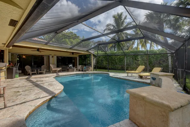 a view of a backyard with sitting area and furniture