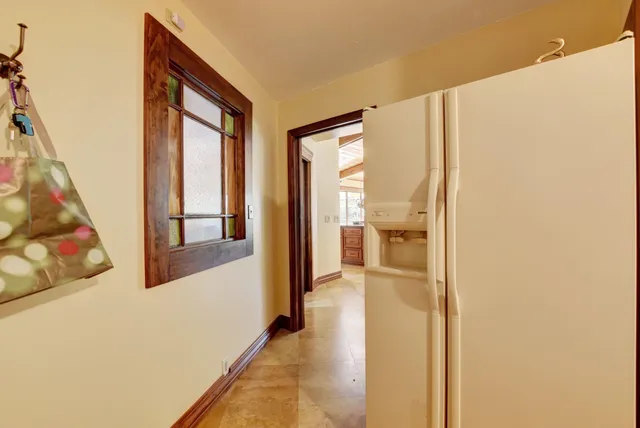 a view of a room with wooden floor and windows