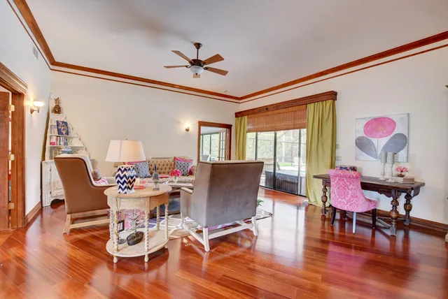 a dining room with furniture window and wooden floor