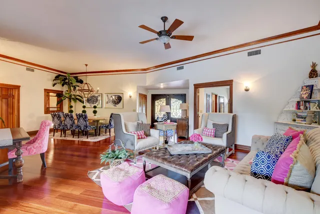 a living room with lots of furniture and a rug