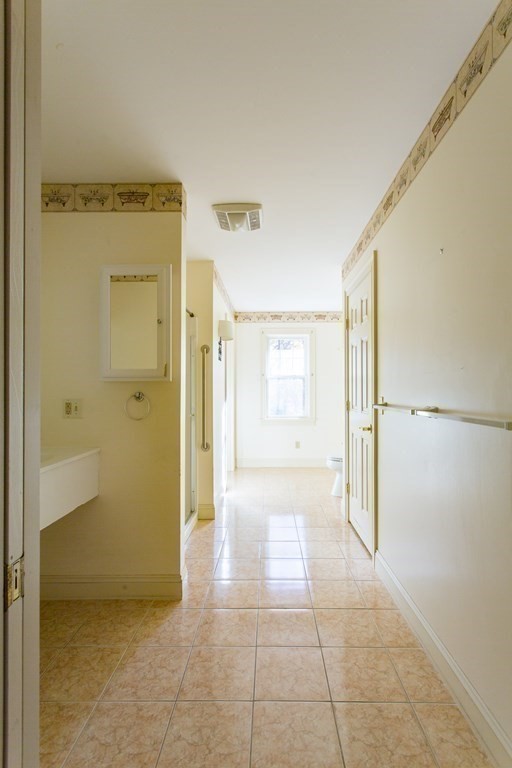 76 Davis Road New Braintree, MA 01531 - Photo 14 of 40 a view of a big room with closet and windows