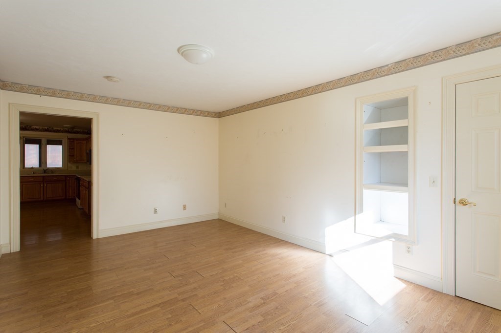 76 Davis Road New Braintree, MA 01531 - Photo 17 of 40 an empty room with wooden floor and windows