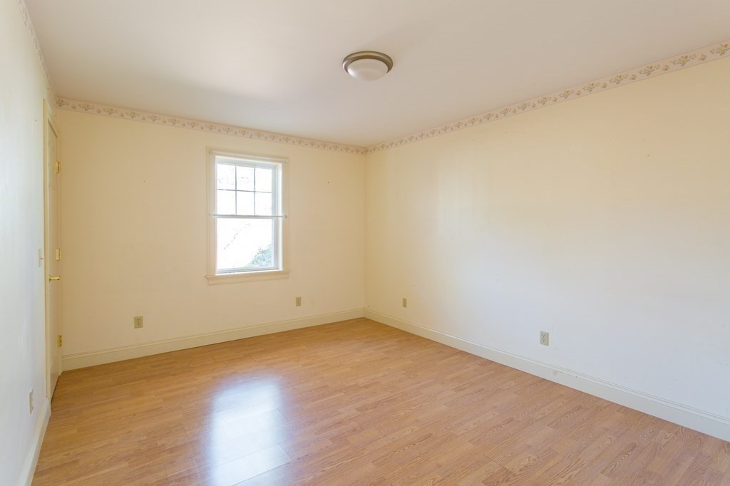 76 Davis Road New Braintree, MA 01531 - Photo 18 of 40 an empty room with wooden floor and windows
