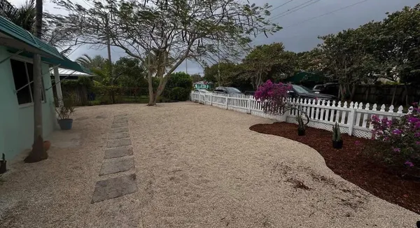 a view of backyard and deck