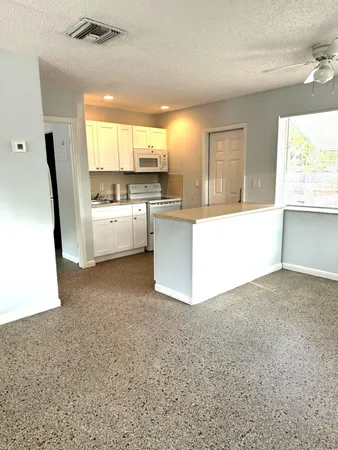 a large white room with a large window