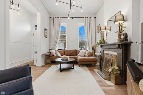 a view of a livingroom with furniture and window