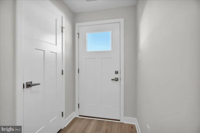 a view of a small space with wooden floor