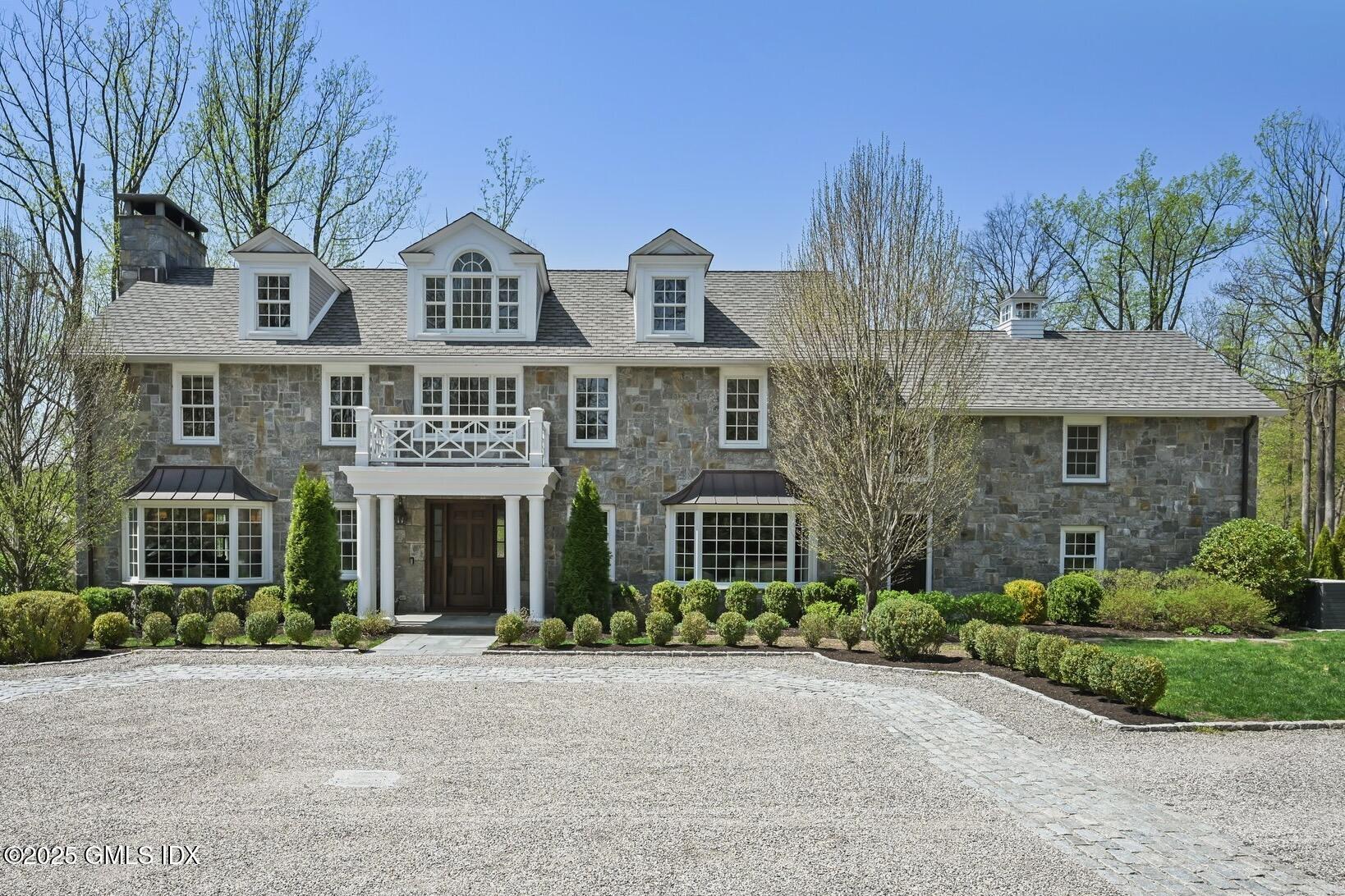 front view of a house with a garden