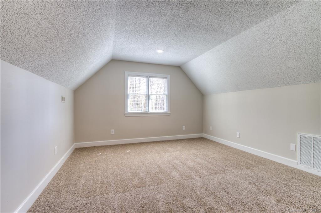 9827 Withers Road Charlotte, NC 28278 - Photo 16 of 24 an empty room with windows