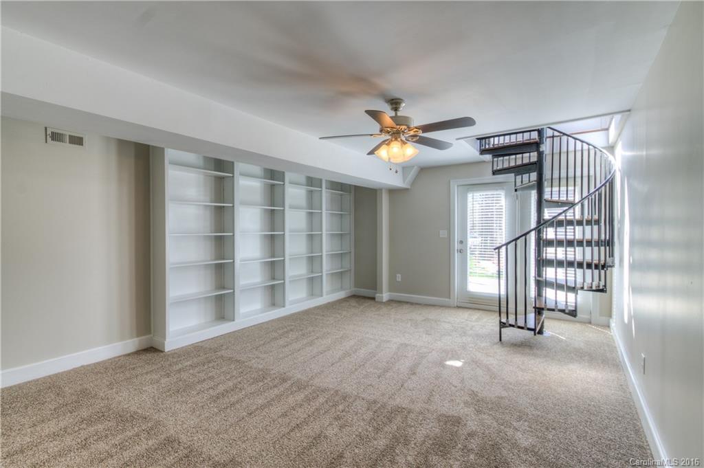 9827 Withers Road Charlotte, NC 28278 - Photo 17 of 24 an empty room with windows and fan