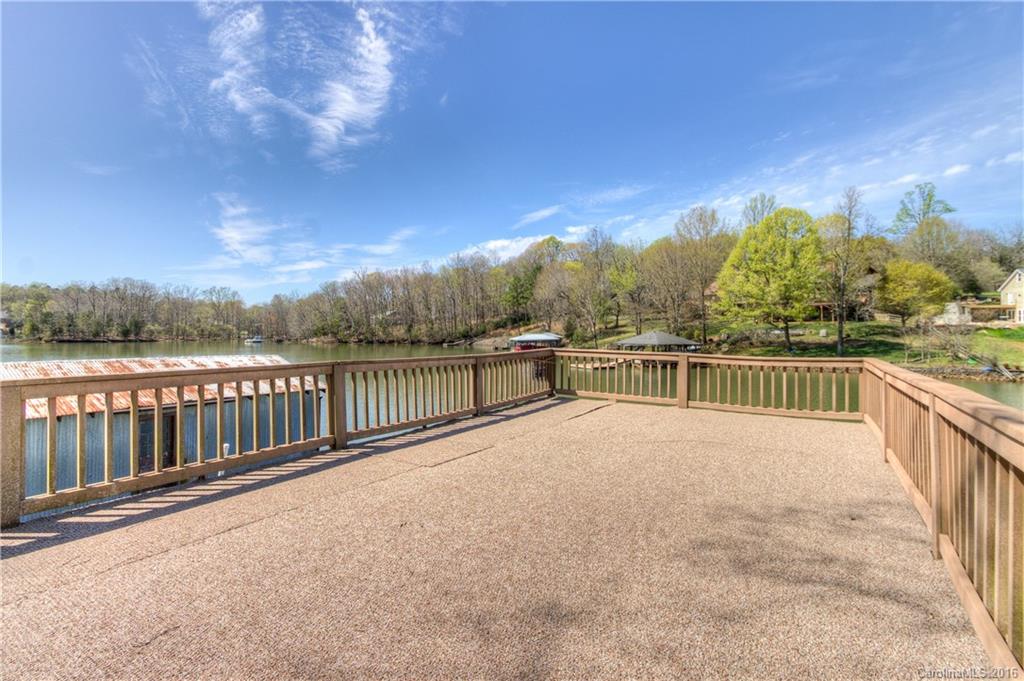9827 Withers Road Charlotte, NC 28278 - Photo 21 of 24 a view of balcony with outdoor space and trees