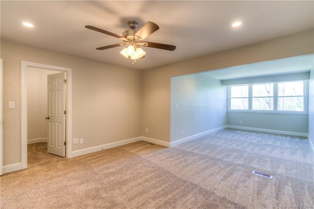 9827 Withers Road Charlotte, NC 28278 - Photo 9 of 24 a view of an empty room and window