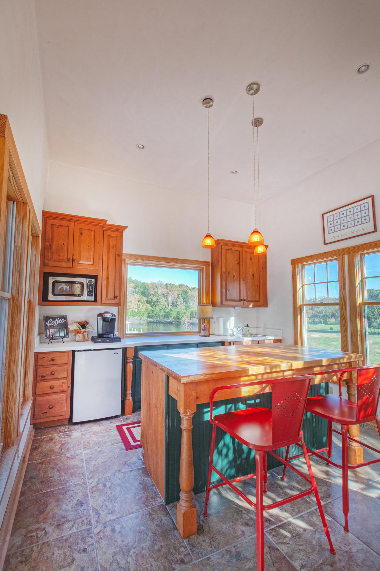 1413 Pollard Road Montvale, VA 24122 - Photo 51 of 68 a kitchen with a stove a refrigerator and wooden cabinets
