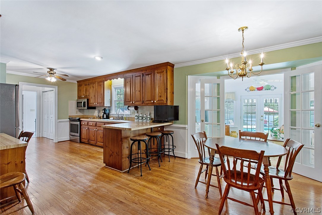 6611 Glebe Point Road Chesterfield, VA 23838 - Photo 12 of 44 a view of a dining room with furniture window and wooden floor