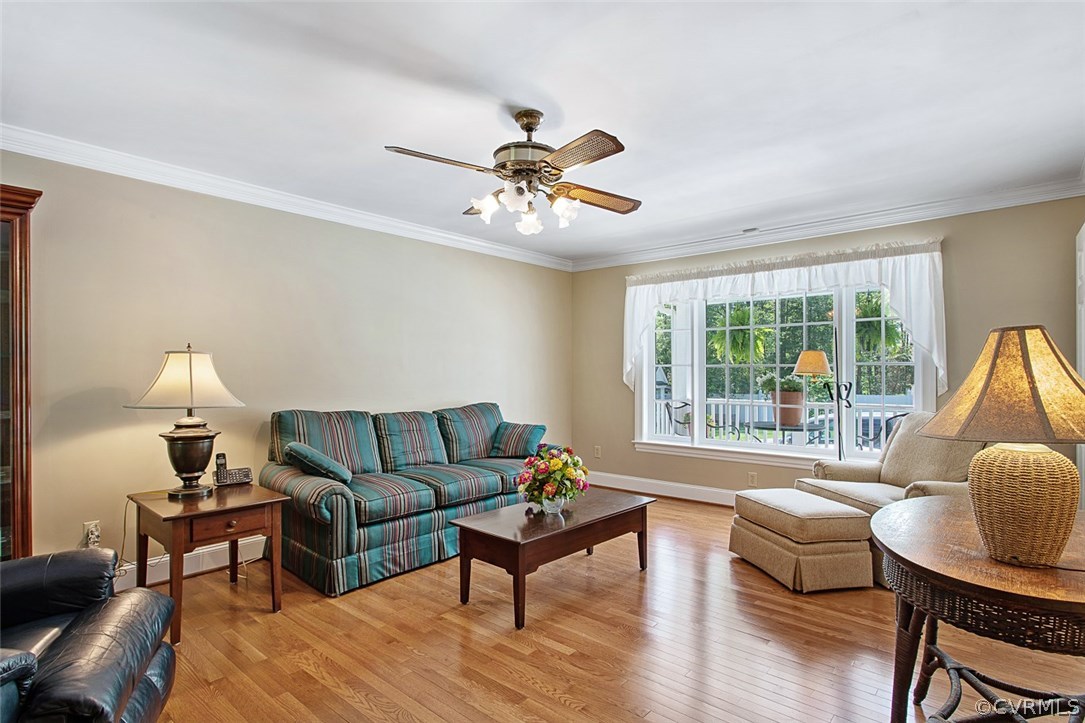 6611 Glebe Point Road Chesterfield, VA 23838 - Photo 18 of 44 a living room with furniture a ceiling fan and a window