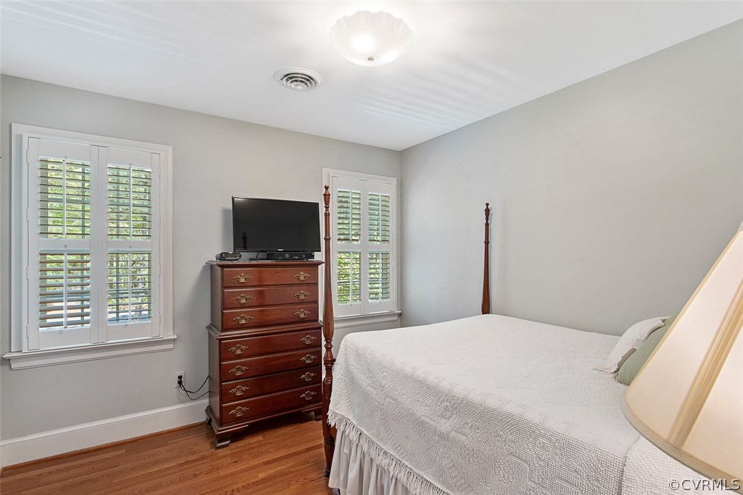 6611 Glebe Point Road Chesterfield, VA 23838 - Photo 26 of 44 a bedroom with a bed and flat screen tv