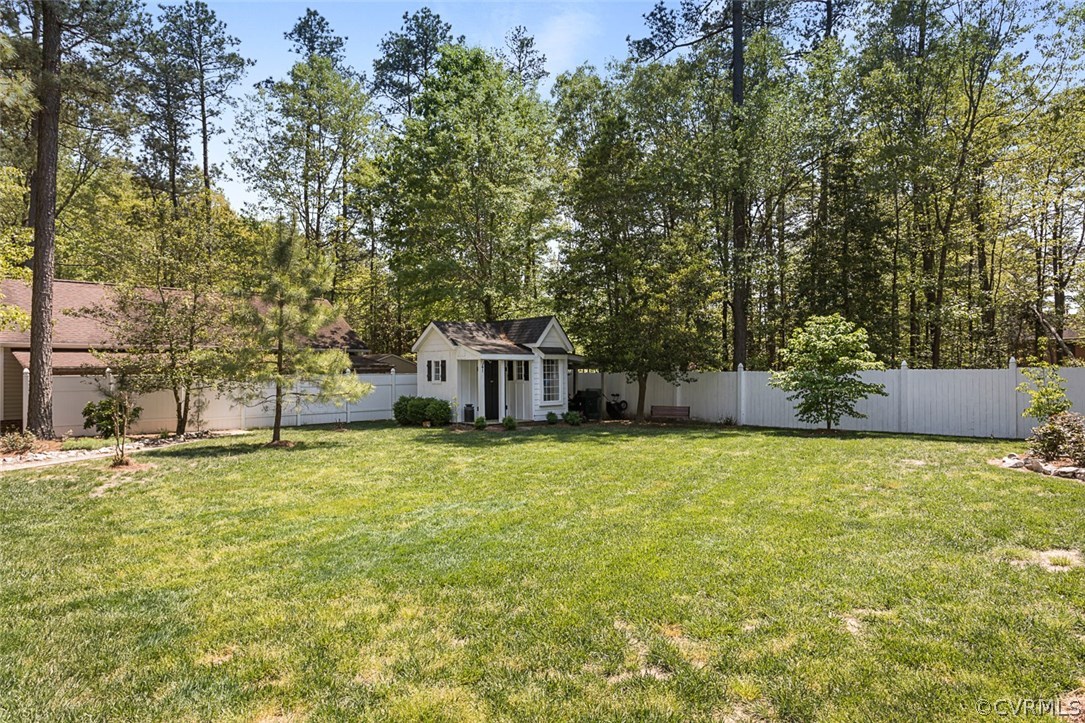 6611 Glebe Point Road Chesterfield, VA 23838 - Photo 30 of 44 a tall wooden house with trees in front of it