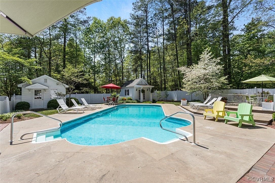 6611 Glebe Point Road Chesterfield, VA 23838 - Photo 33 of 44 a view of backyard with swimming pool and seating space