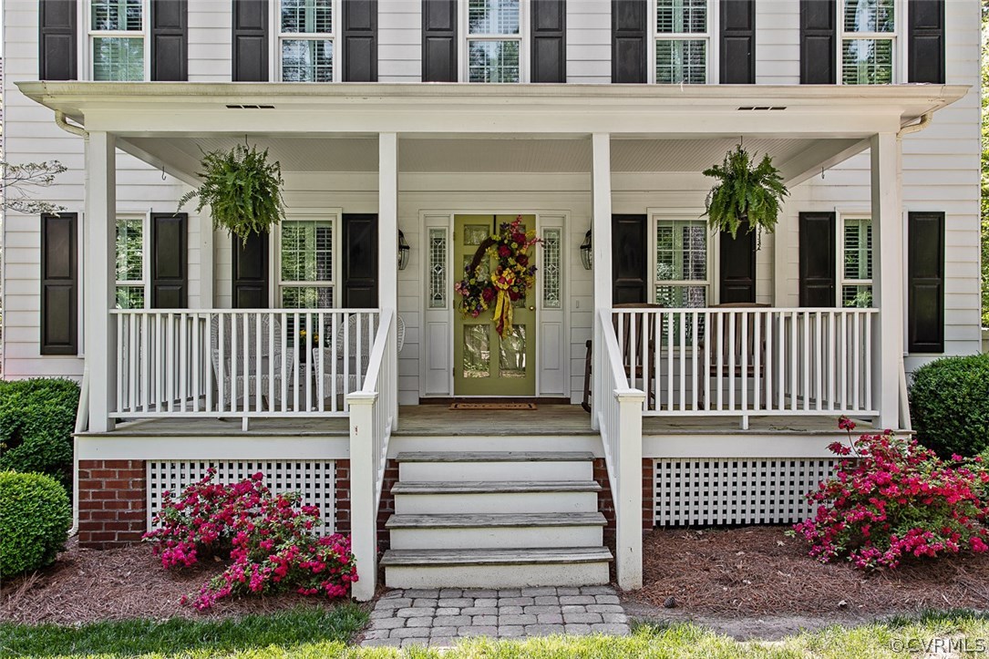 6611 Glebe Point Road Chesterfield, VA 23838 - Photo 5 of 44 a view of a house with a small yard and flower plants